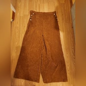 Large wide leg brown cords with gold buttons on both sides